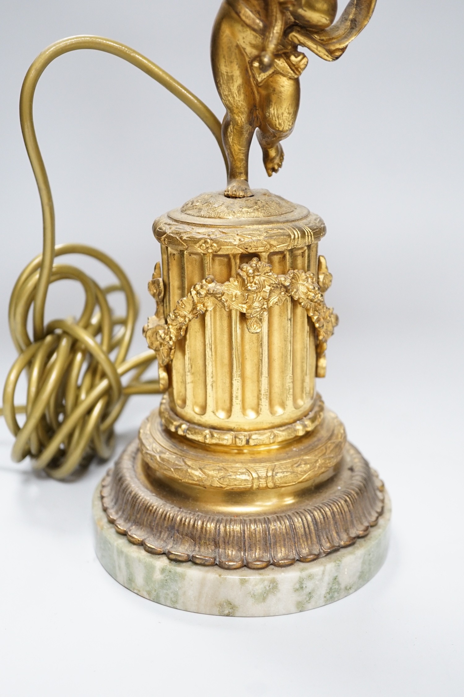 An ornate six branch ormolu cherub candelabrum, converted to a lamp, 54cms high
